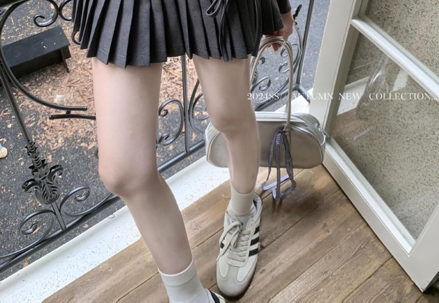 High-Rise Bow-Accented Accordion Pleated Mini Flare Skirt