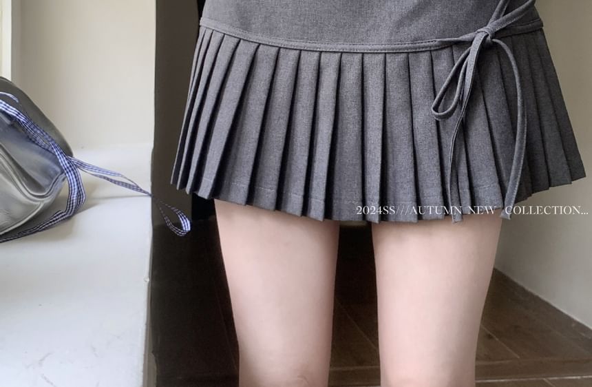 High-Rise Bow-Accented Accordion Pleated Mini Flare Skirt