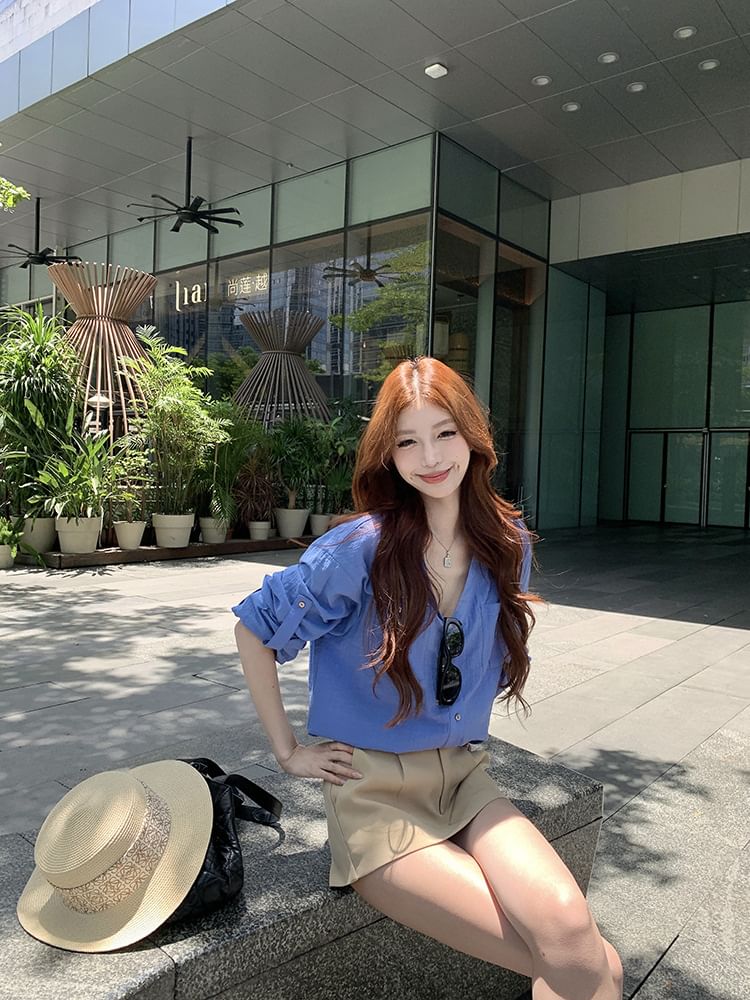 Long-Sleeve V-Neck Solid Blouse Paired with High-Waist Flared Mini Skirt