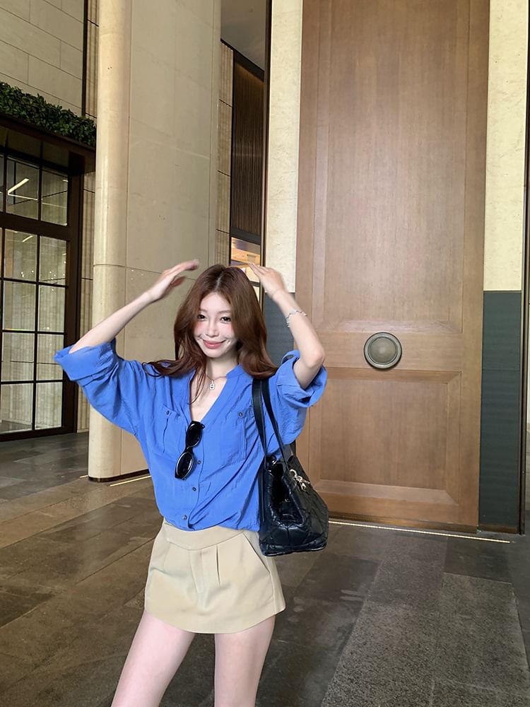 Long-Sleeve V-Neck Solid Blouse Paired with High-Waist Flared Mini Skirt