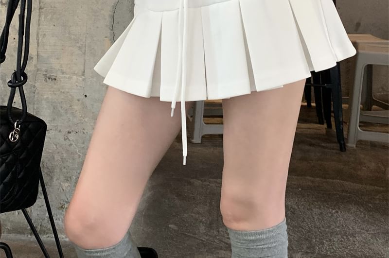 V-Neck Oversized Hoodie, High-Waist Mini Pleated Skirt & Scoop Neck Tank