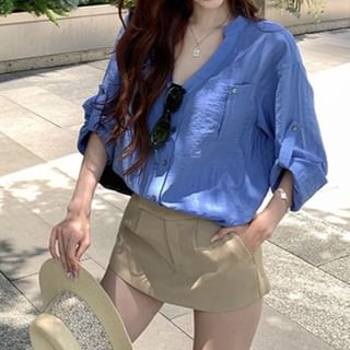Long-Sleeve V-Neck Solid Blouse Paired with High-Waist Flared Mini Skirt