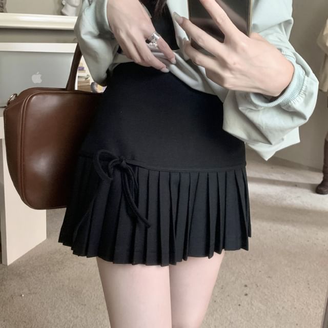 High-Rise Bow-Accented Accordion Pleated Mini Flare Skirt
